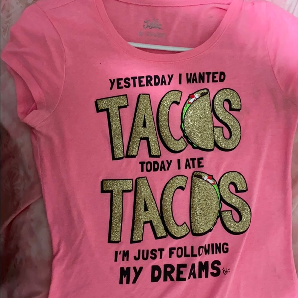 A glittery t-shirt with glittery words on it